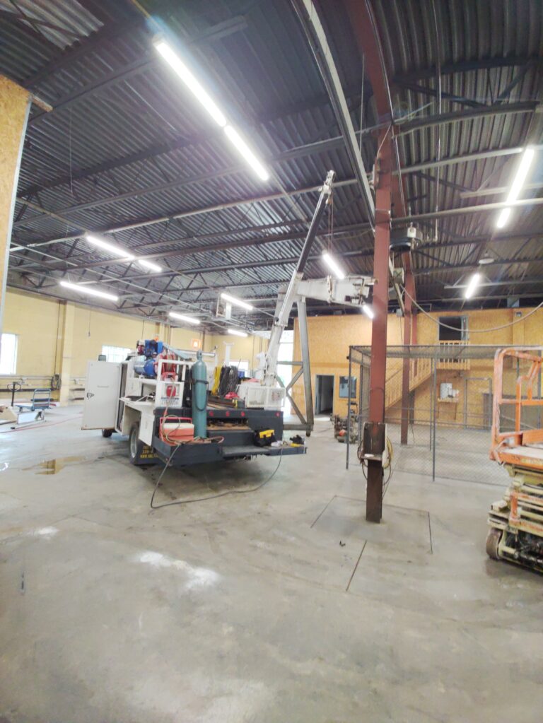 Interior structural steel column reinforcement and welding work inside a commercial industrial facility in Pennsylvania.