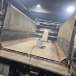 Custom fabricated steel dump truck bed built and welded for heavy duty hauling and industrial applications.