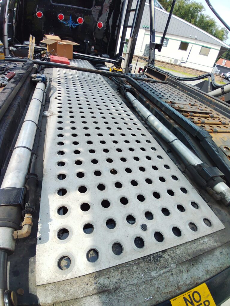 Custom fabricated perforated steel deck panel installed on a heavy duty truck platform in Pennsylvania.