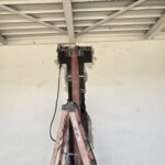 Structural steel column installation through an existing concrete wall during a commercial building reinforcement project in Pennsylvania.