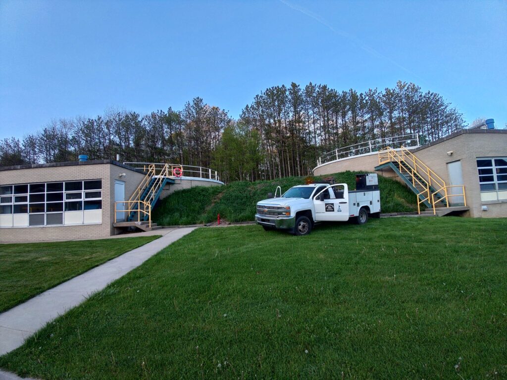Mobile welding truck at industrial facility with steel staircases and safety railings in Pennsylvania