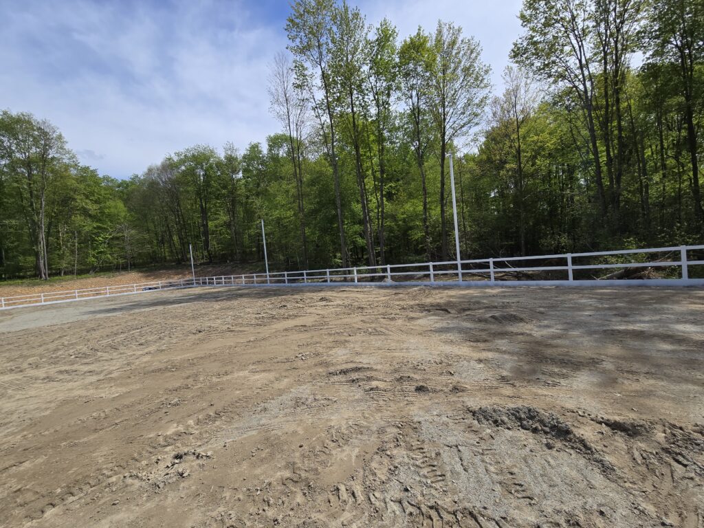 White steel perimeter fence installed along a commercial property boundary