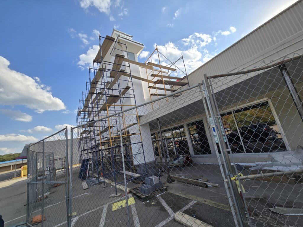 Commercial building expansion with structural steel framing and scaffolding in Pennsylvania