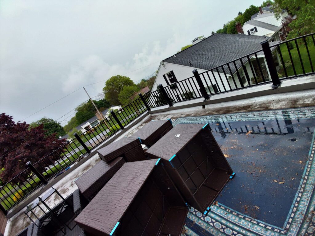 Custom black steel safety railing installed along elevated terrace in Pennsylvania
