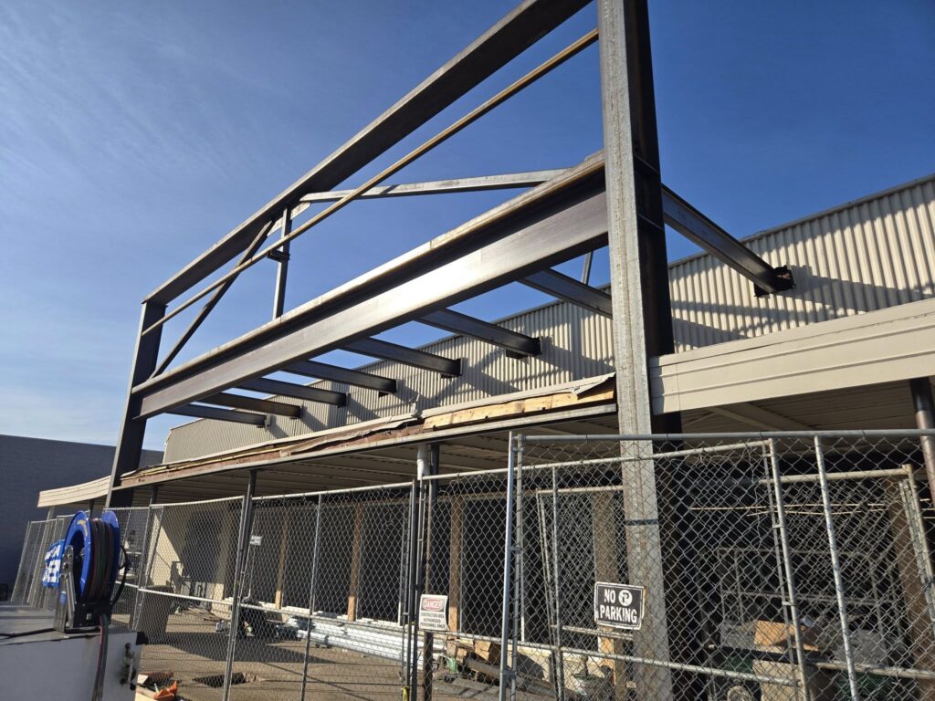 Commercial structural steel frame installation for building roof extension in Pennsylvania