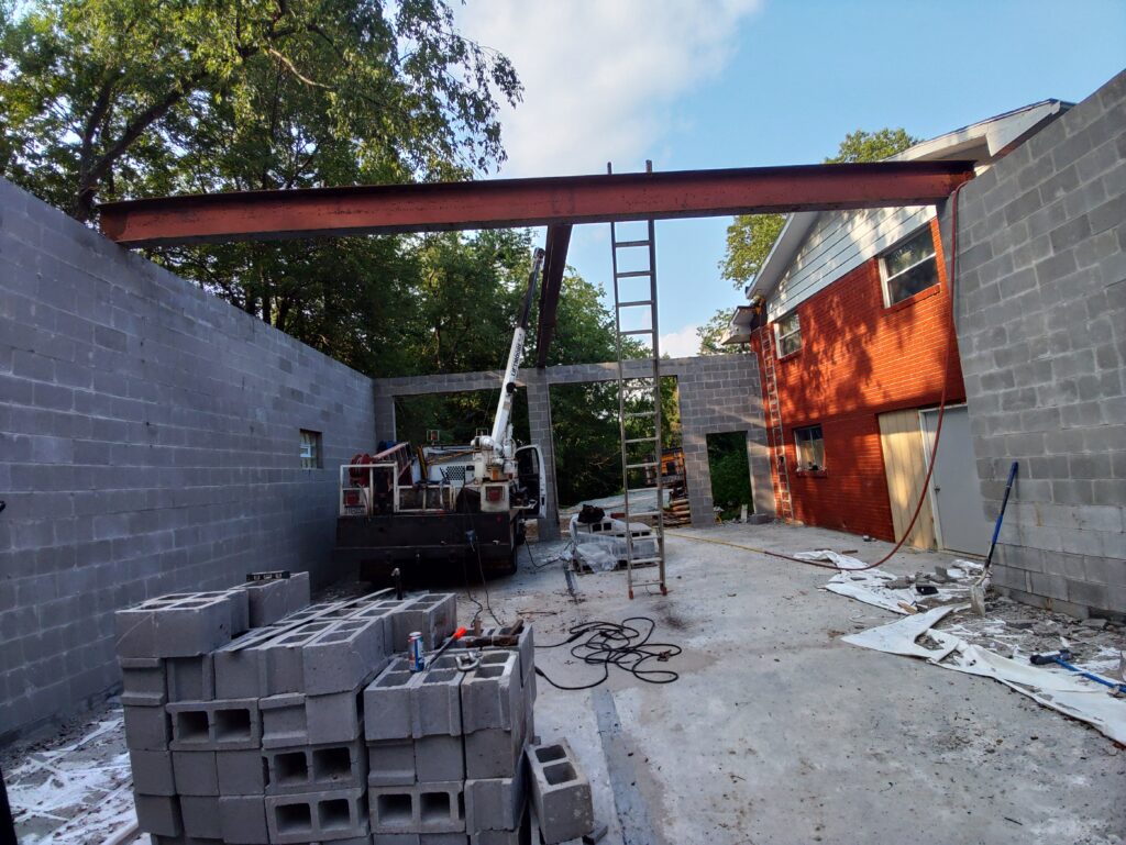 Structural steel beam installation for commercial building construction