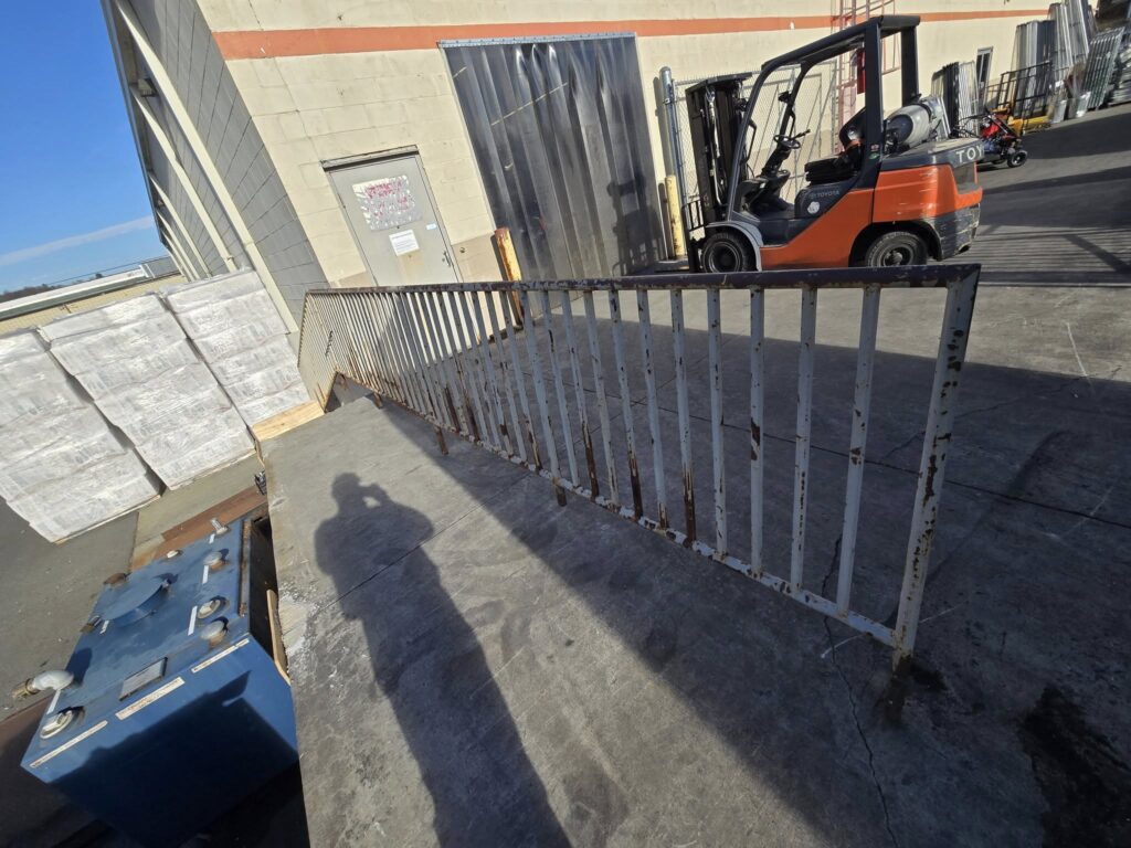 Steel guardrail fabrication and installation at commercial loading area