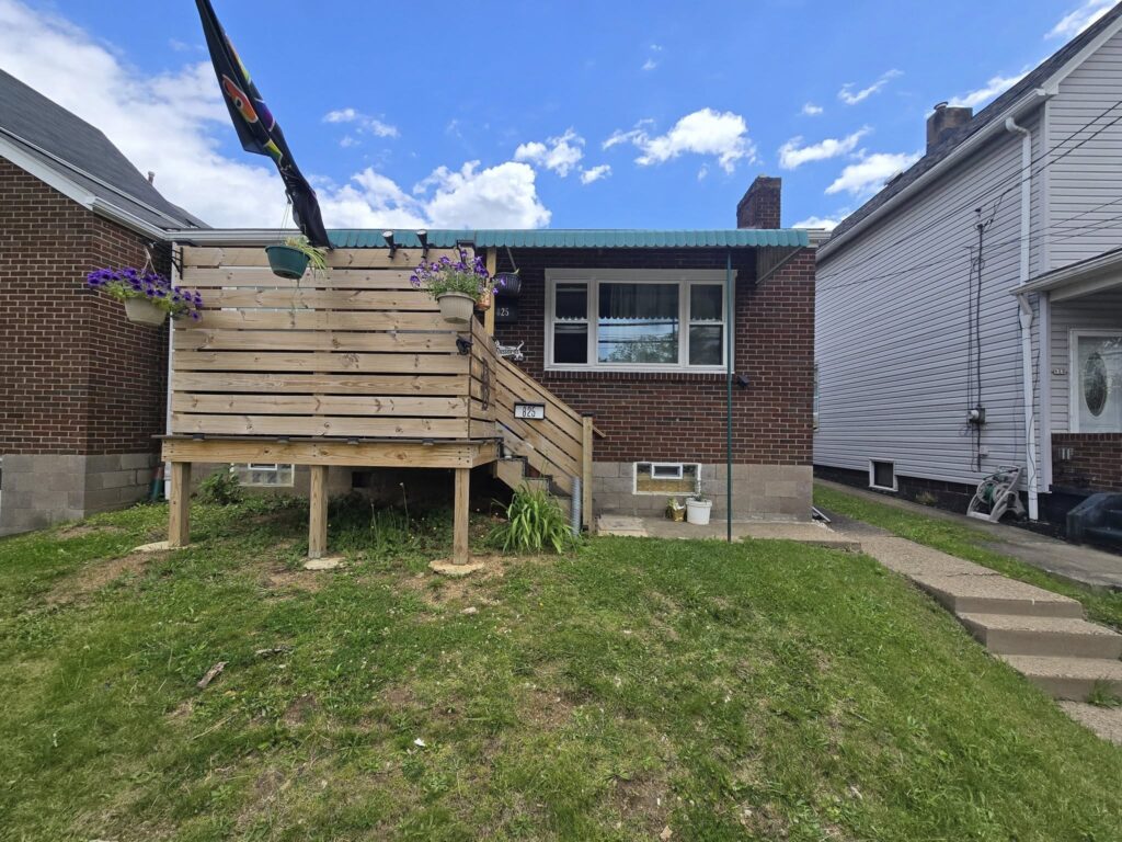 Custom steel support structure installed for elevated residential deck