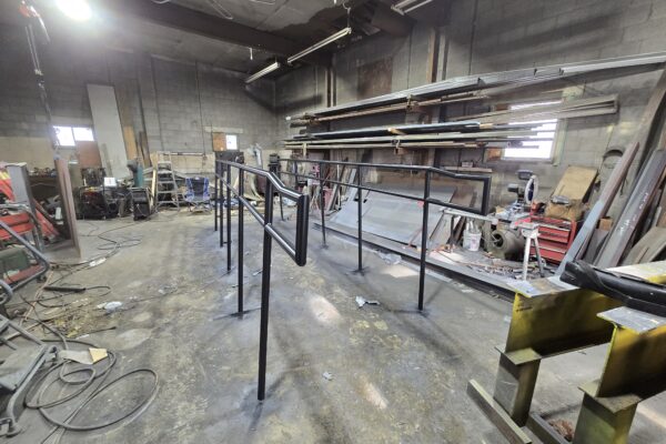 Custom steel handrail system fabricated inside welding shop