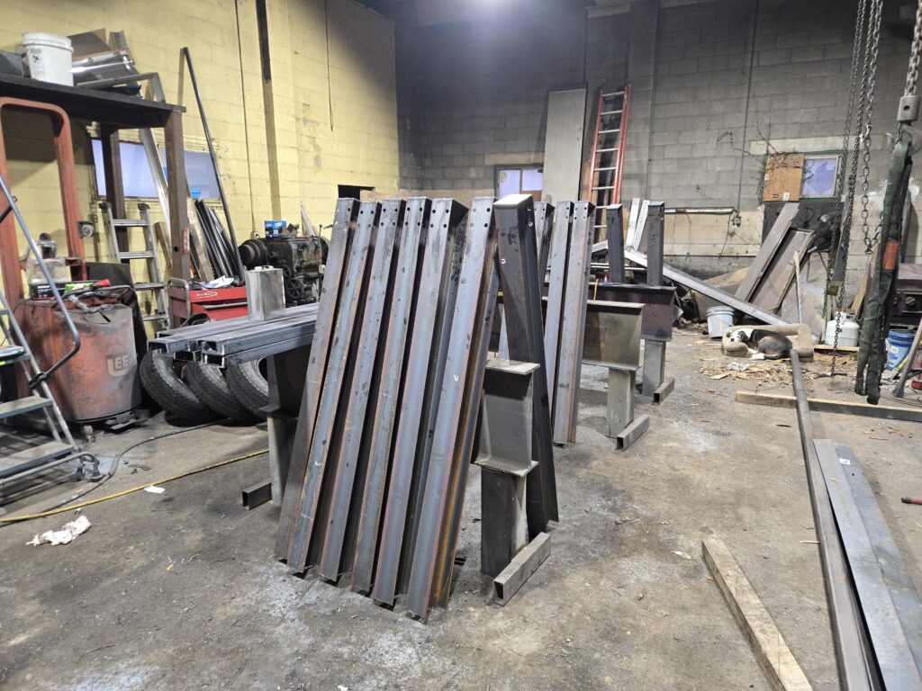 Custom steel support posts fabricated and prepared inside welding shop in Pennsylvania