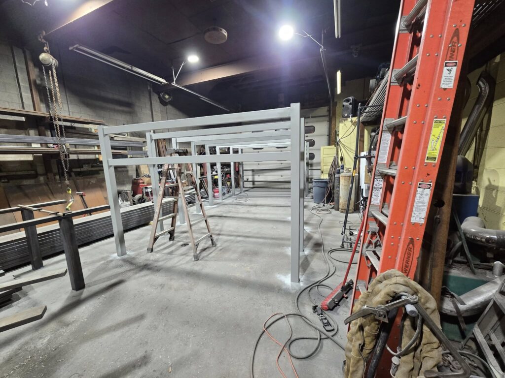 Custom steel structural frames being fabricated and welded inside welding shop in Pennsylvania