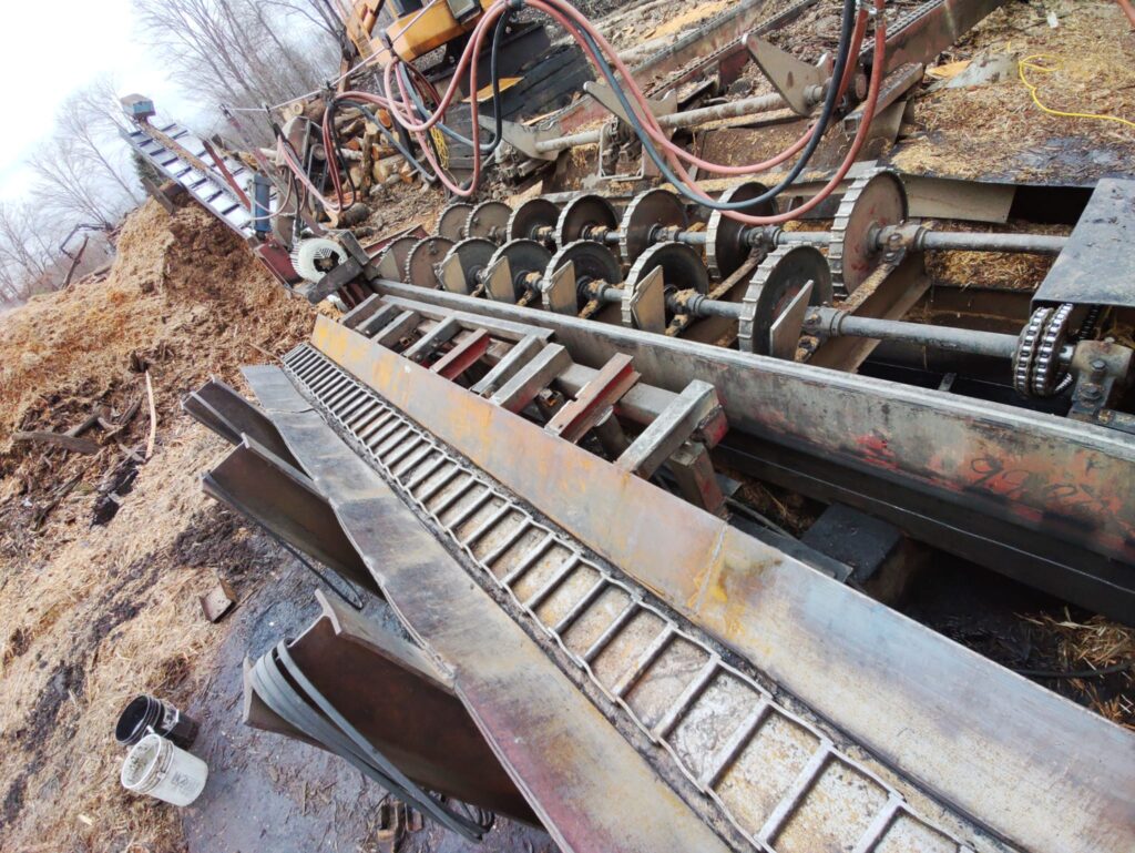 Industrial auger conveyor welding repair for wood processing equipment in Pennsylvania