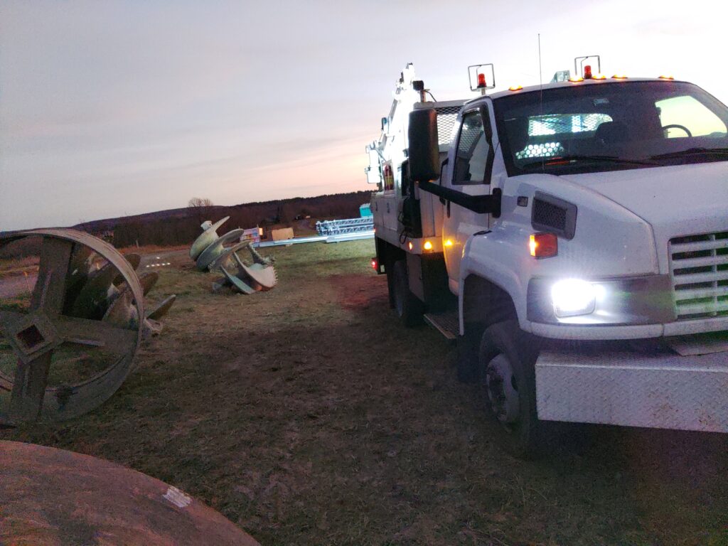 Mobile welding service truck performing field repair near utility equipment in Pennsylvania