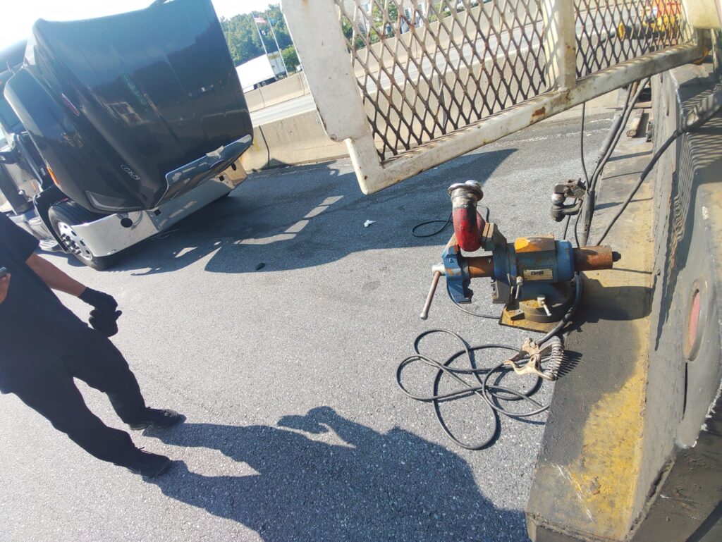 Mobile welding equipment repairing truck trailer component on site