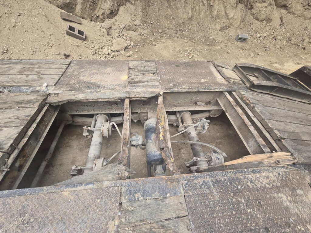 Trailer frame and axle welding repair at construction job site