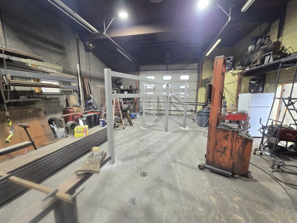 Custom structural steel frame fabricated inside welding shop