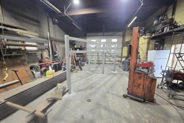 Custom structural steel frame fabricated inside welding shop