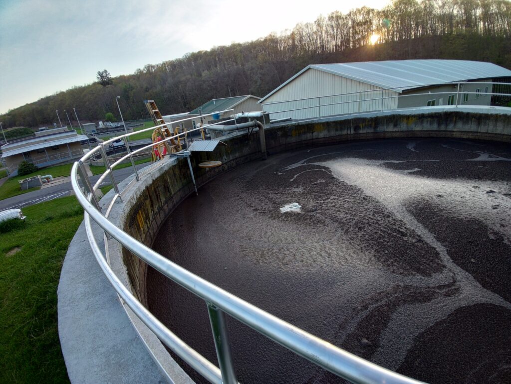Stainless steel safety railing installed around wastewater treatment tank in Pennsylvania