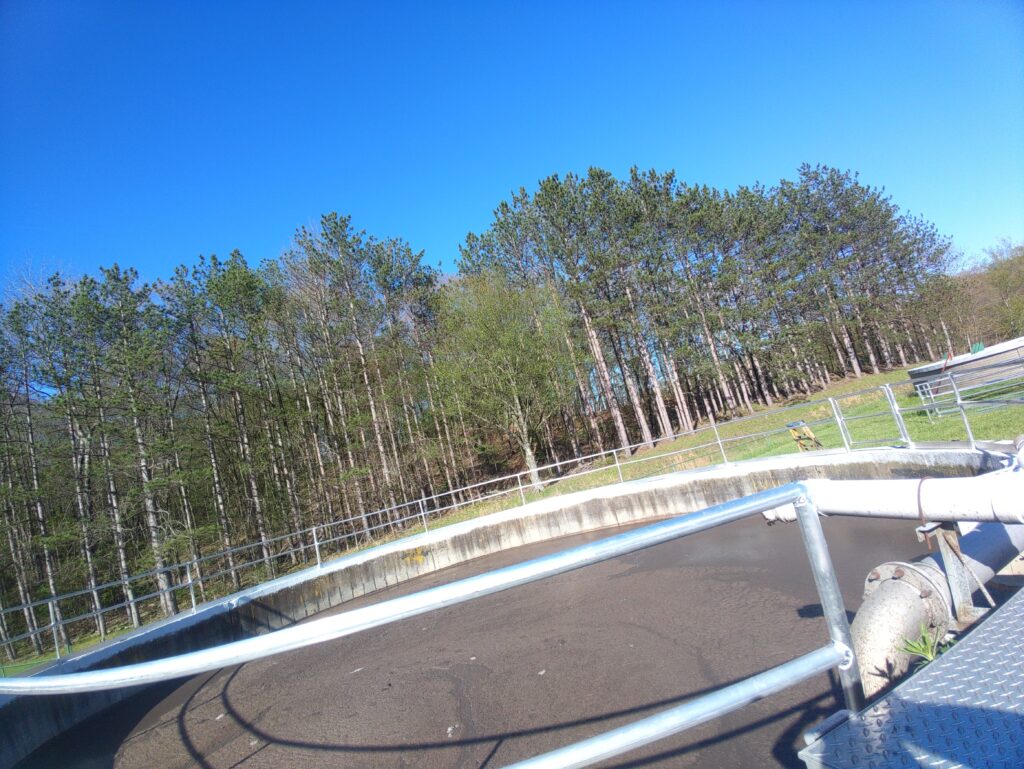 Steel safety railing installed around wastewater treatment tank