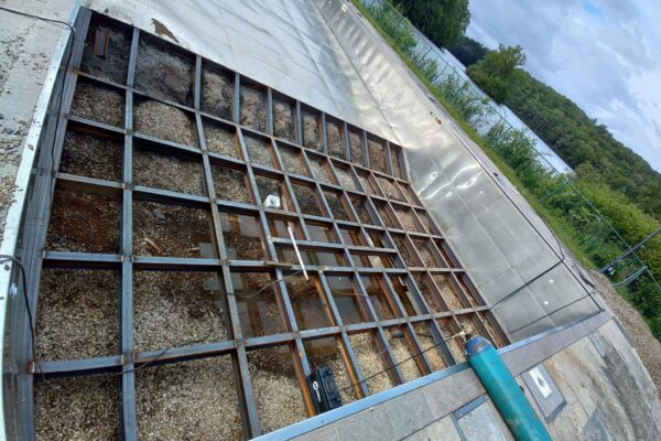 Structural steel platform framing installed for an industrial wastewater treatment facility upgrade and equipment support system.