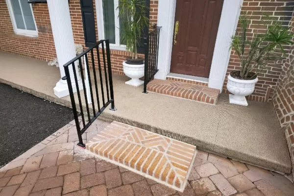 Custom steel porch handrails fabricated and installed by Mobile Welding Solutions for a residential entrance in Pennsylvania.